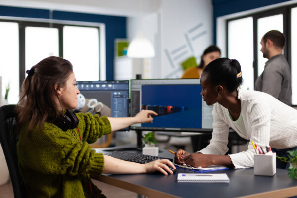 Two women looking at a computer screen