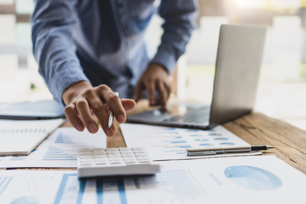 Businessman working on financial documents in the office.