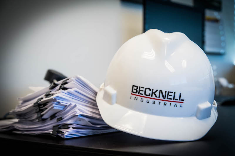 Becknell Industrial name and logo on a hard hat