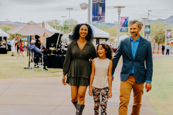 A family at a festival in Las Vegas during the day