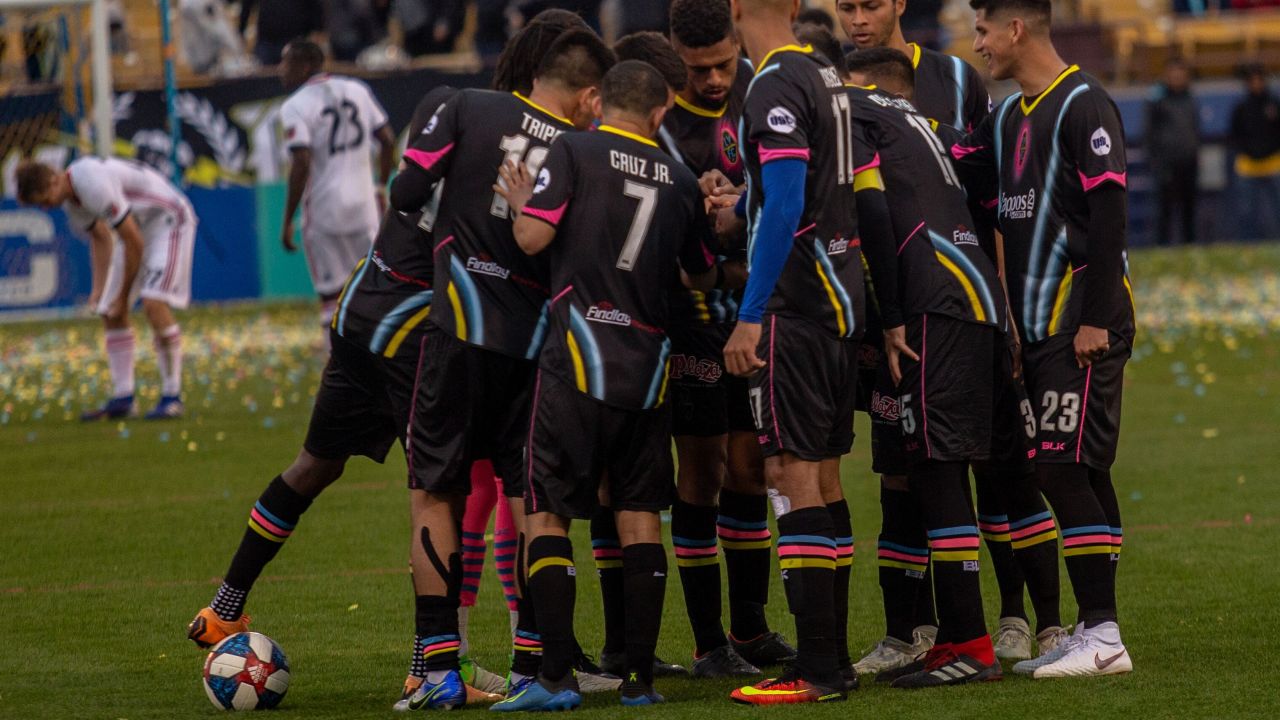 Las Vegas Lights (Soccer) players huddle on the field