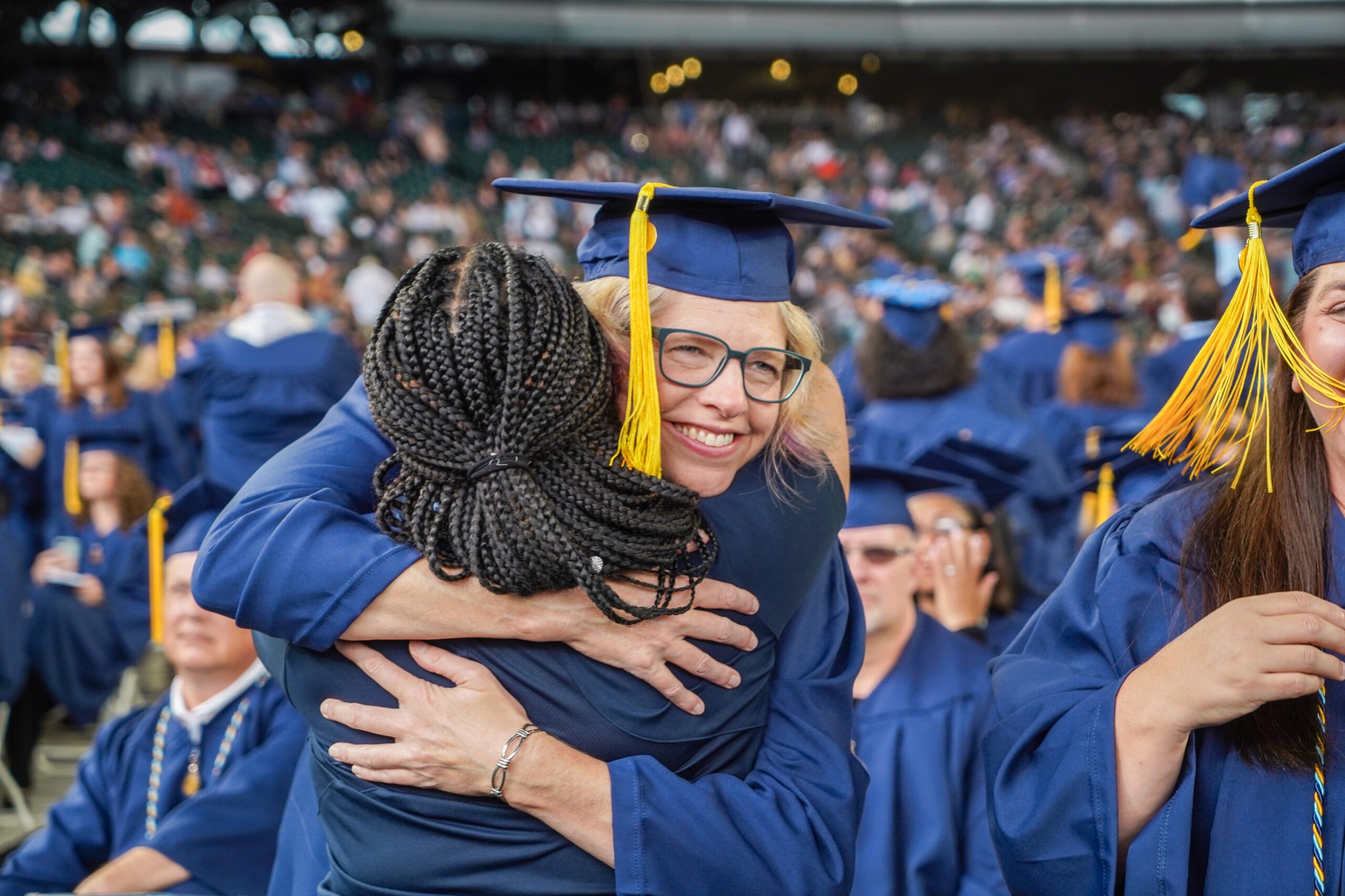 Two people hugging during a college graduation at Western Governors University in Las Vegas