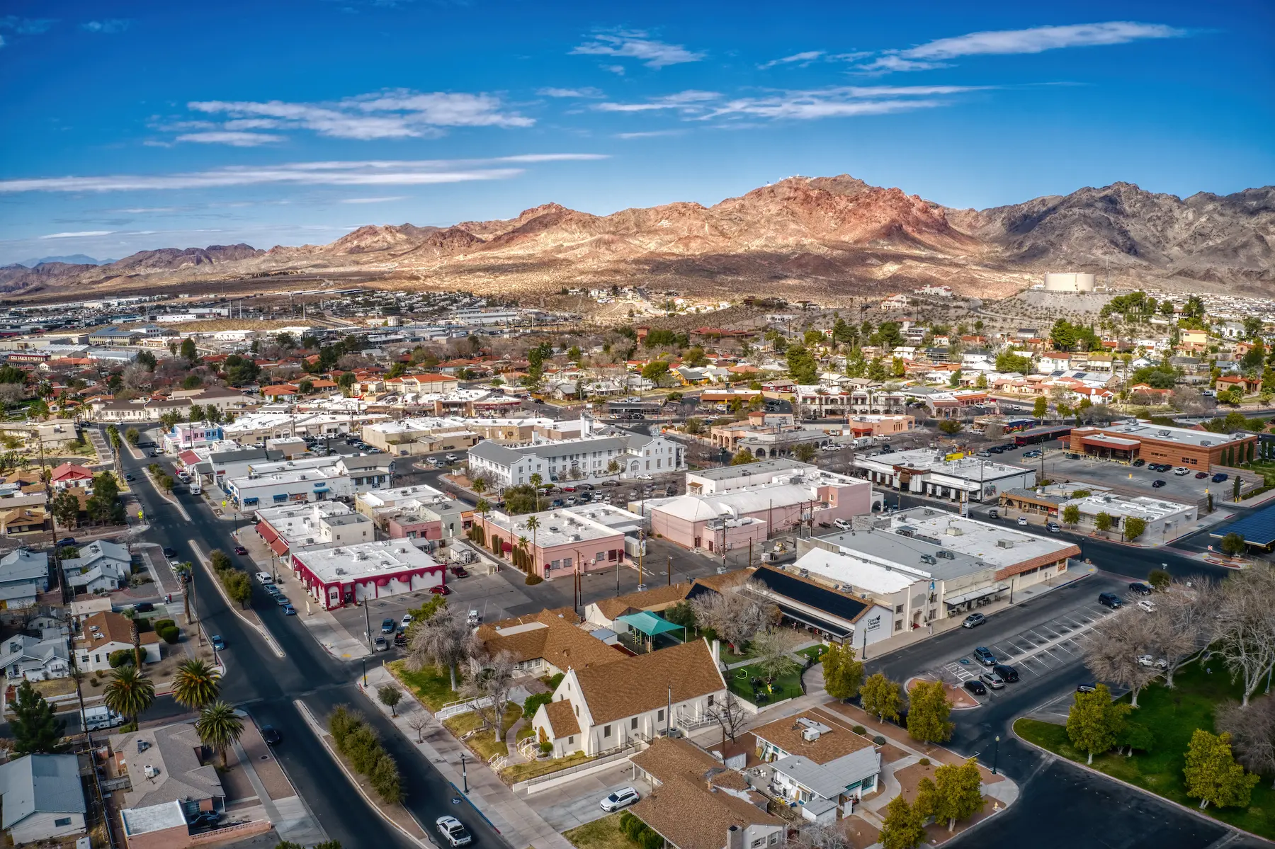 Downtown Boulder City – A small-town setting with historic buildings, a mountain backdrop, and a wide aerial view of the streets.