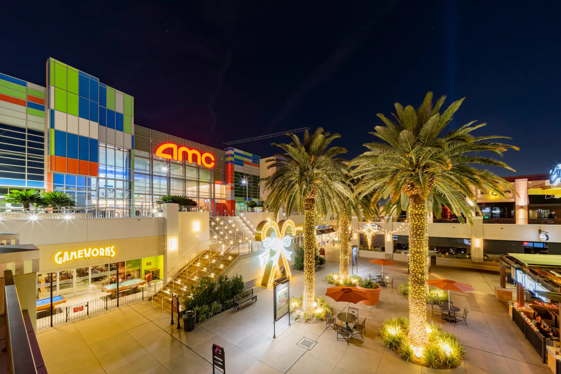 Town Square Las Vegas – A lively outdoor shopping center with palm trees, string lights, and a mix of retail and dining options.